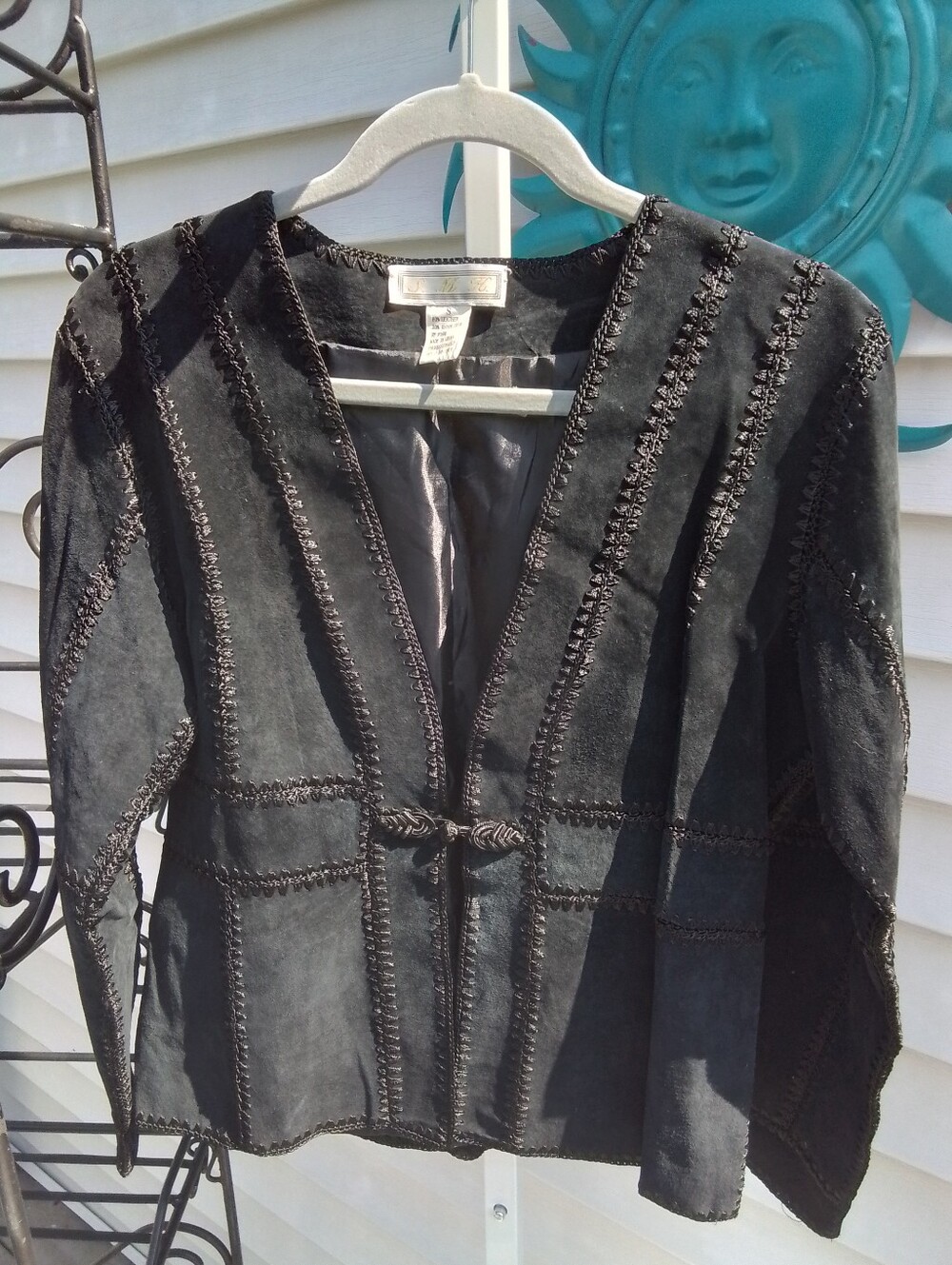 Vintage-Inspired Black Suede Jacket with Decorative Stitching